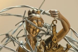 Lady Justice and Barbed Wire