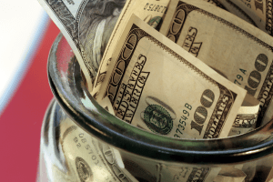 U.S. dollars in a jar
